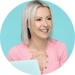 Holly Locastro with straight, light blonde hair wearing a light pink top sits in front of a light blue background, partially visible behind an open laptop.