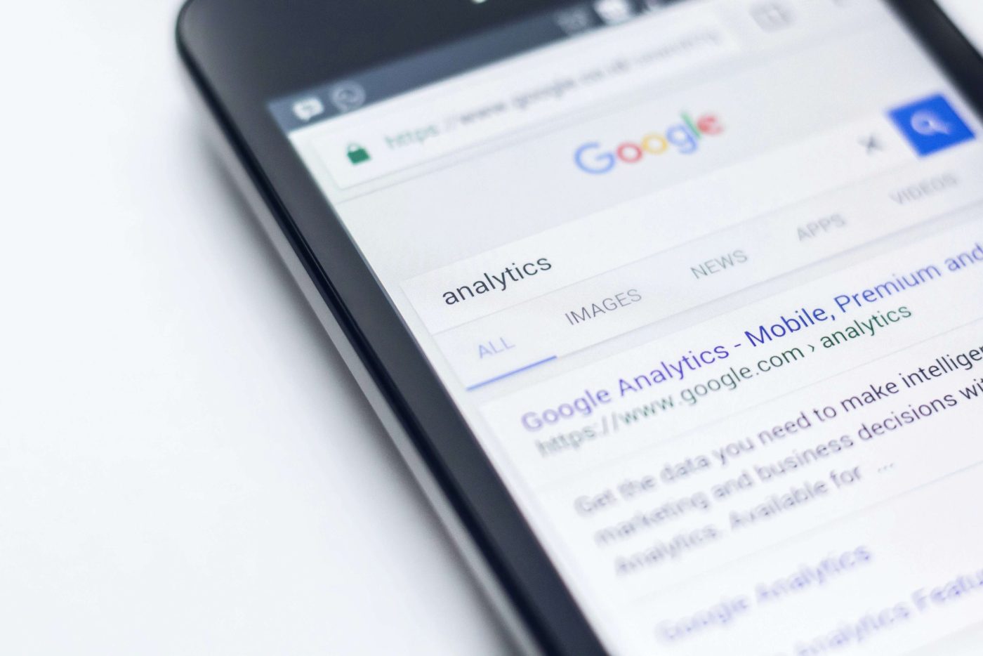 Smartphone screen showing a Google search for "analytics.